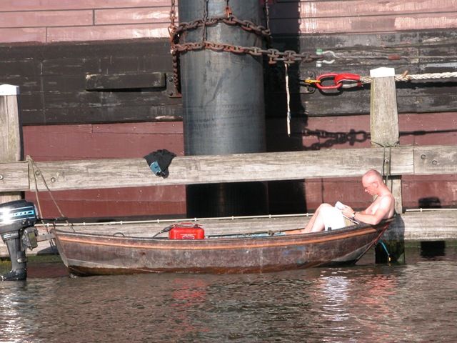 Amsterdam boat reading sunny spring