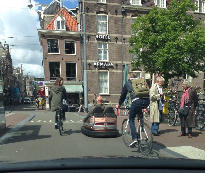 Man drives bumper car through the streets of Amsterdam in his