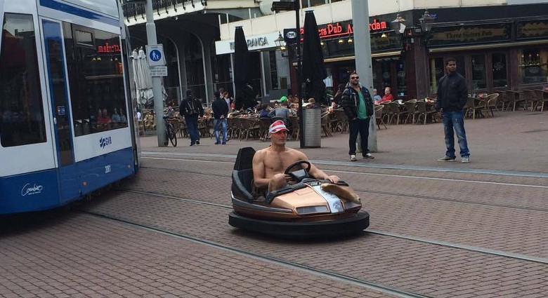 Man drives bumper car through the streets of Amsterdam in his